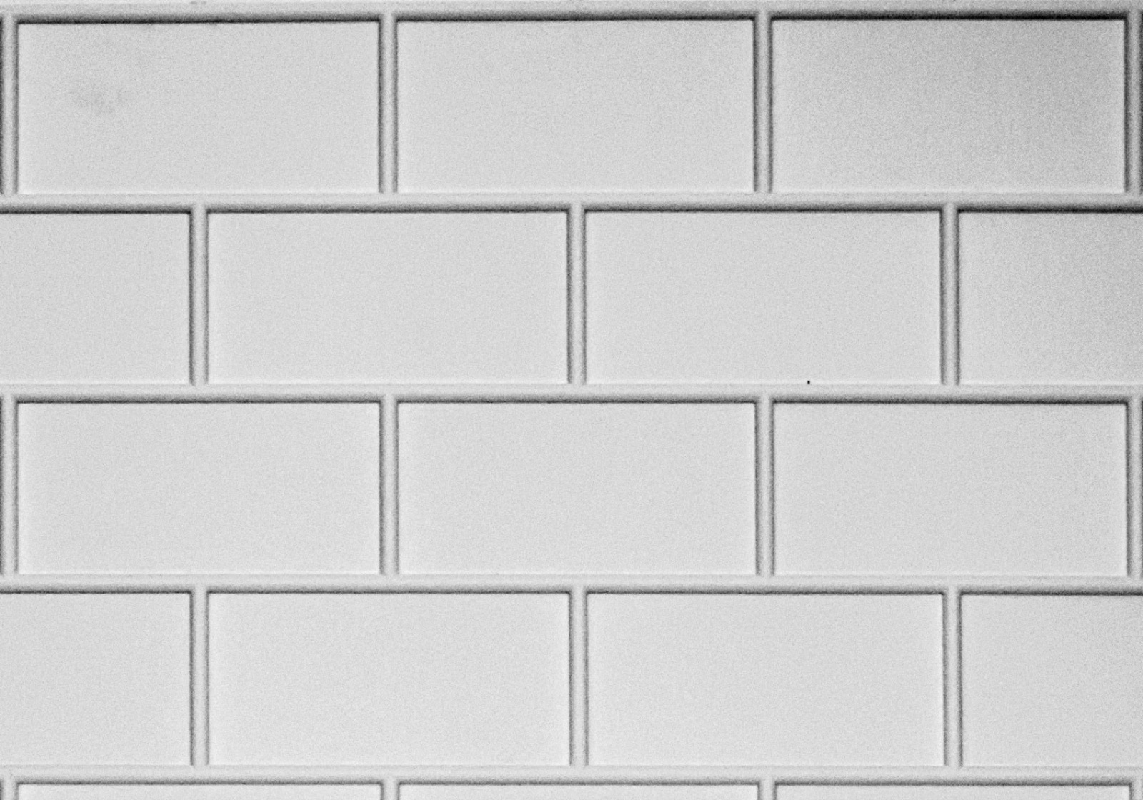 Thin brick cast into an embedded brick panel