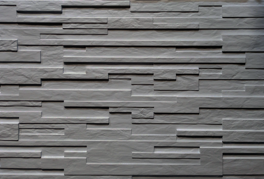 Random 1 and a half inch plank with varying depths textured formliner pattern cast in concrete