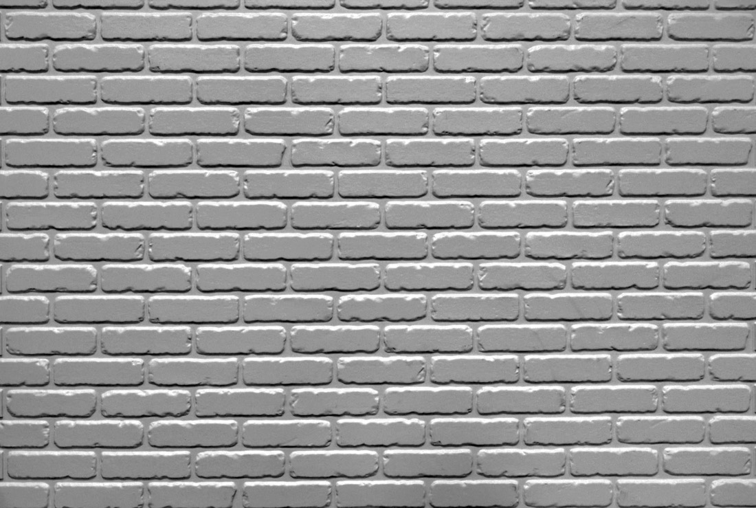 Half bond modular tumbled brick formliner pattern cast in concrete